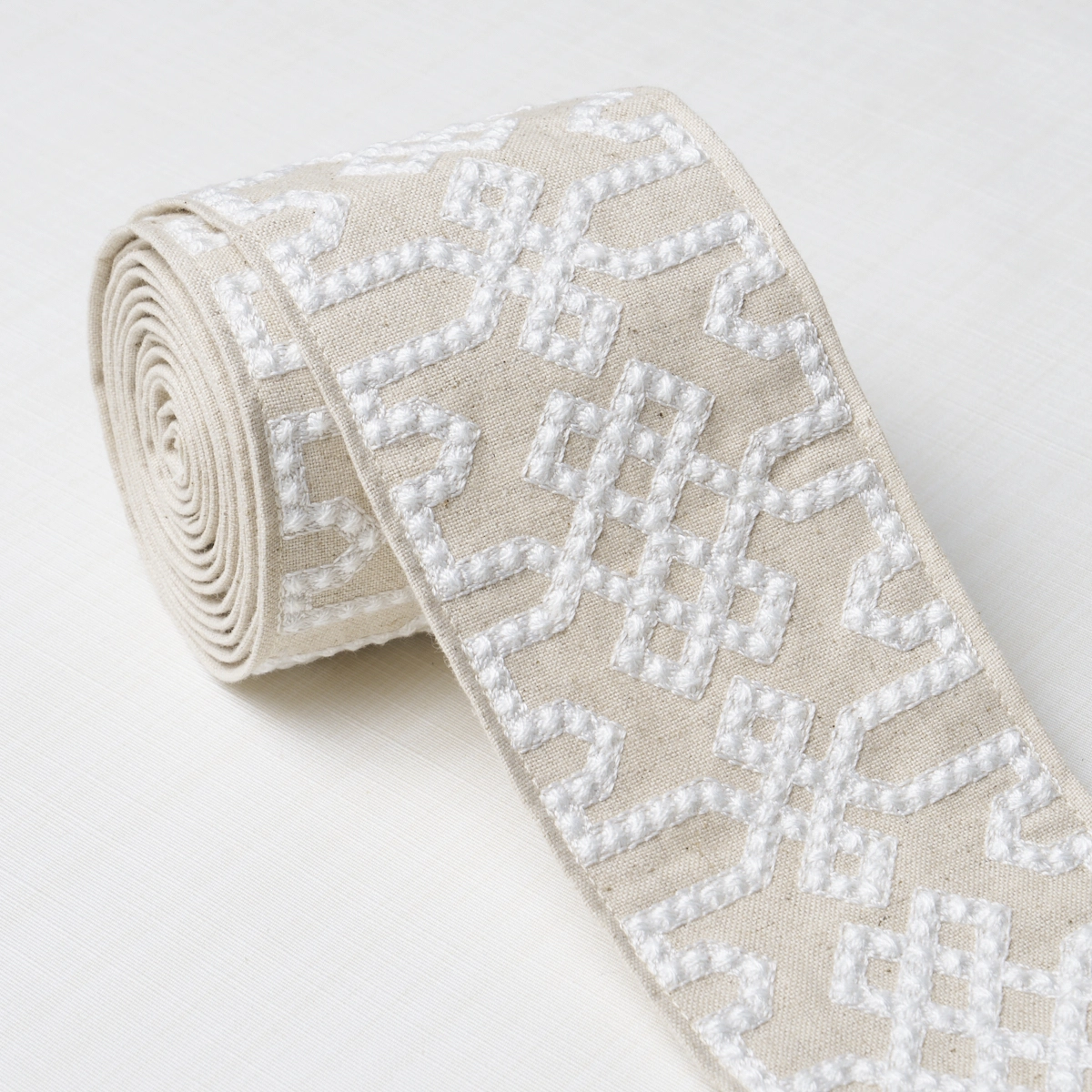 KNOTTED TRELLIS TAPE_ GREY ON NEUTRAL